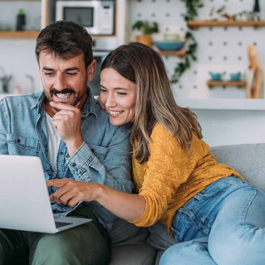 Couple does their financial planning on the computer Couple does their financial planning on the computer