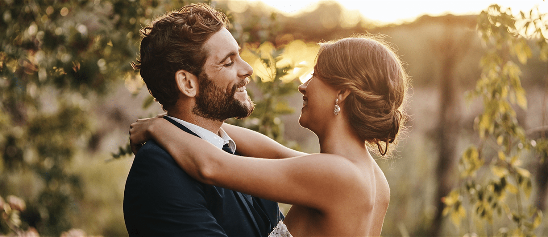 Newlywed couple hugging happily Newlywed couple hugging happily