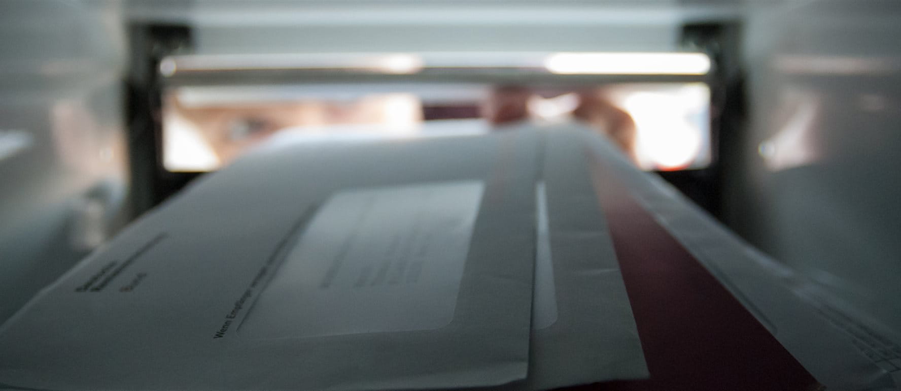 Letters lie in a letterbox Letters lie in a letterbox