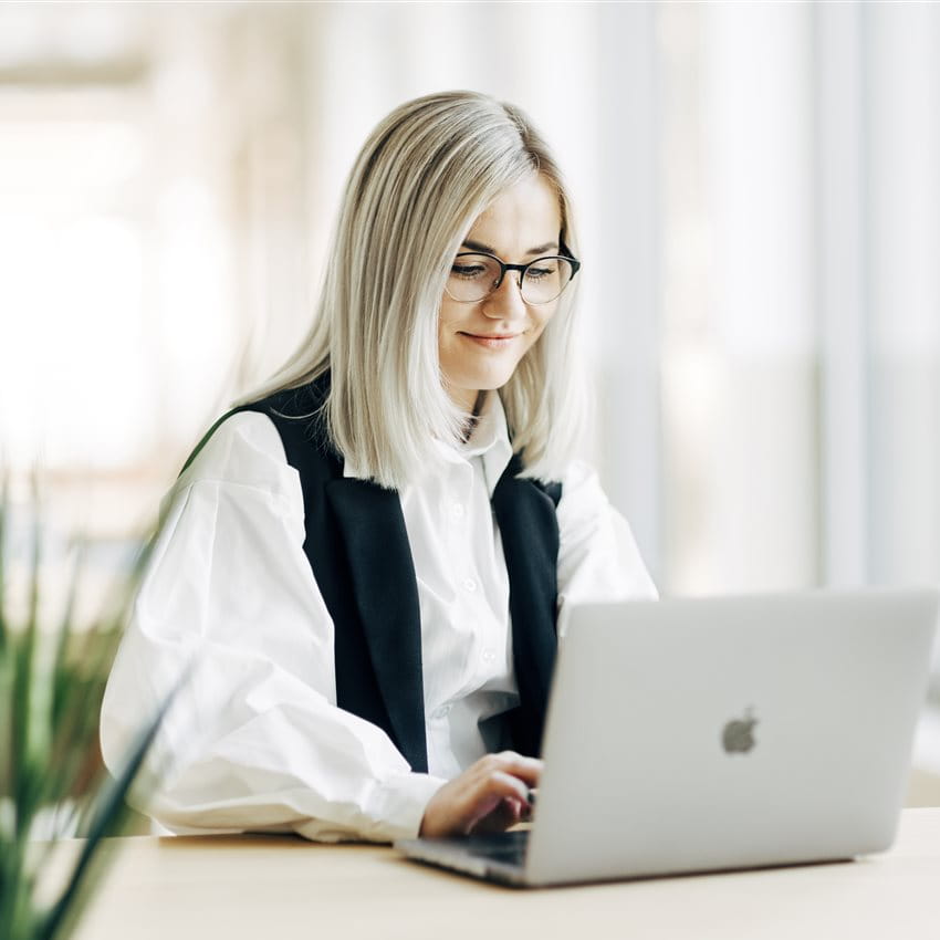 A woman is working on the laptop A woman is working on the laptop