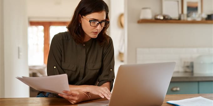 A woman is working on a laptop A woman is working on a laptop