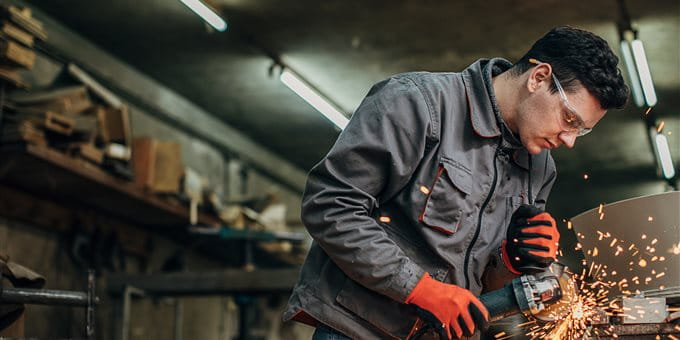 A man is working on a construction site  A man is working on a construction site