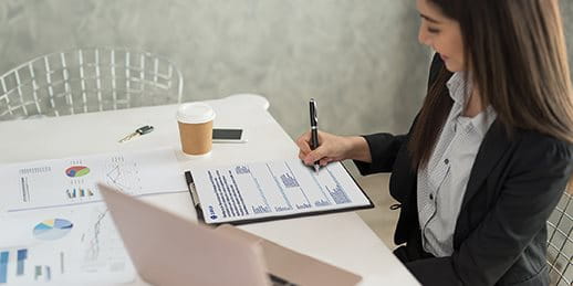 A woman fills out a form A woman fills out a form