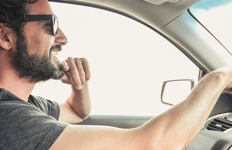 man at the wheel of a car man at the wheel of a car