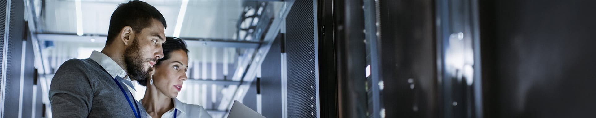 Two employees in the server room Two employees in the server room