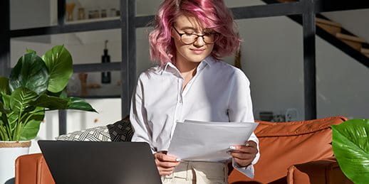 Woman on laptop in the living room Woman on laptop in the living room