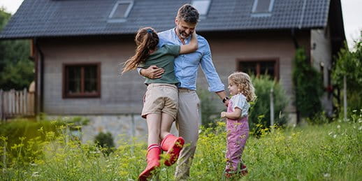 Father playing with his children in the meadow Father playing with his children in the meadow