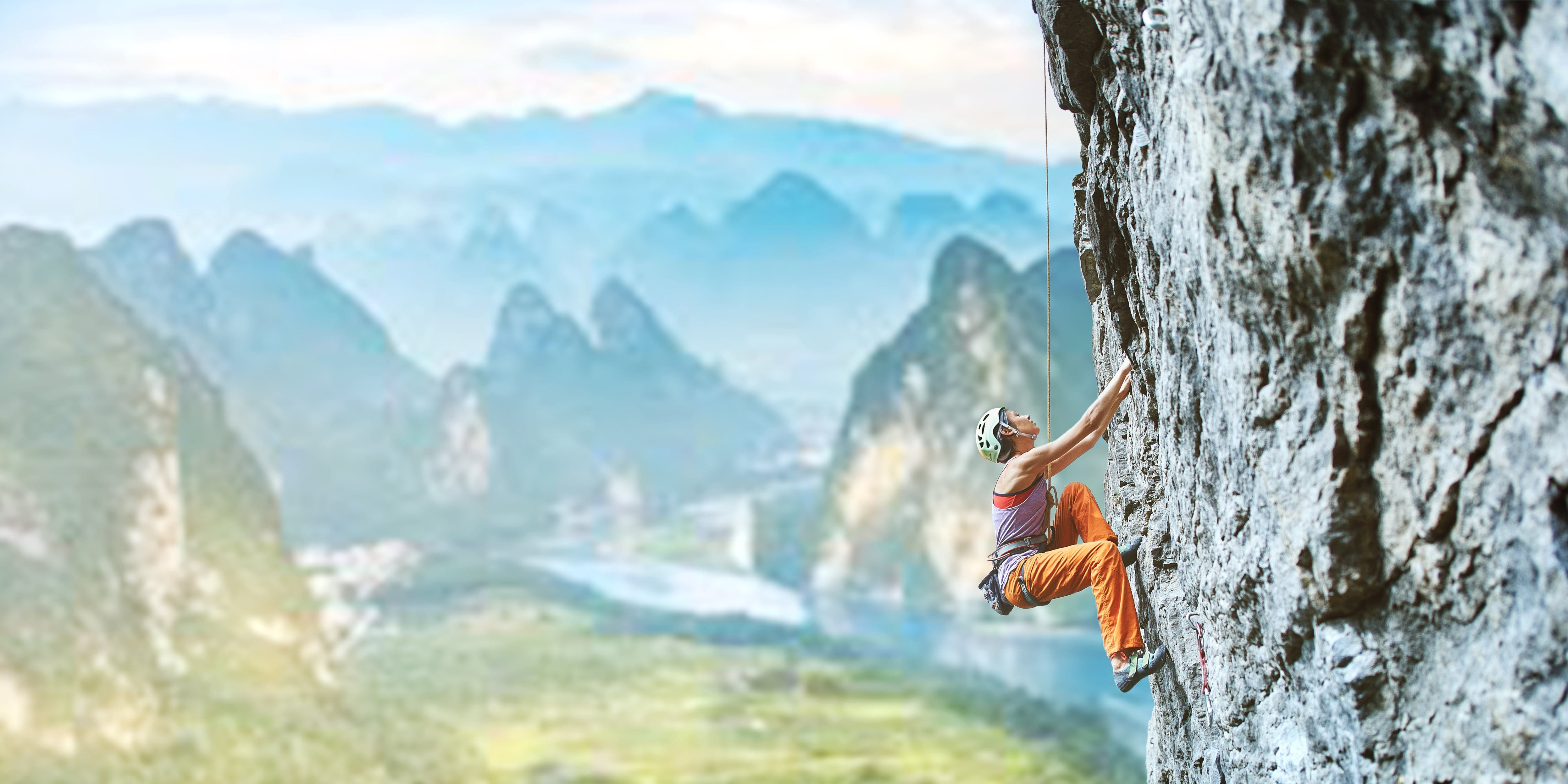Mountaineer climbing on a rock Mountaineer climbing on a rock