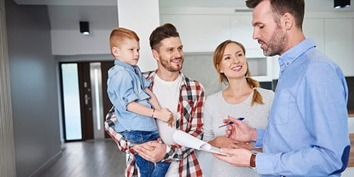 Family during a consultation with a real estate agent Family during a consultation with a real estate agent