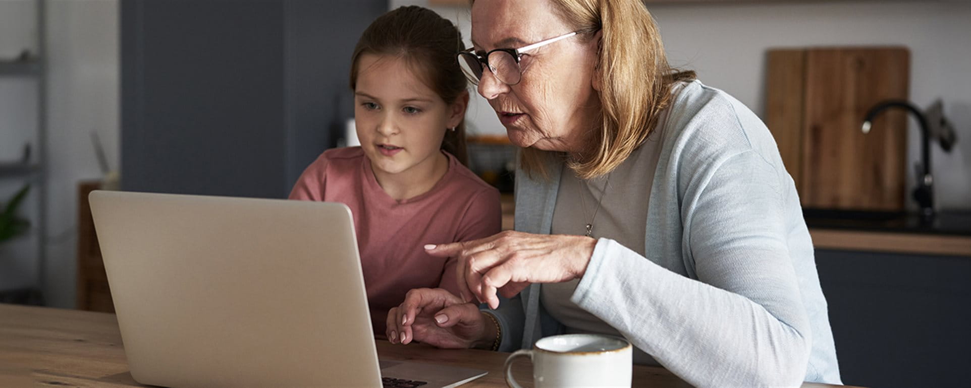 Woman sitting with child at laptop Woman sitting with child at laptop