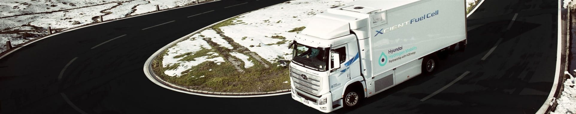 Hydrogen-powered truck on a mountain road Hydrogen-powered truck on a mountain road